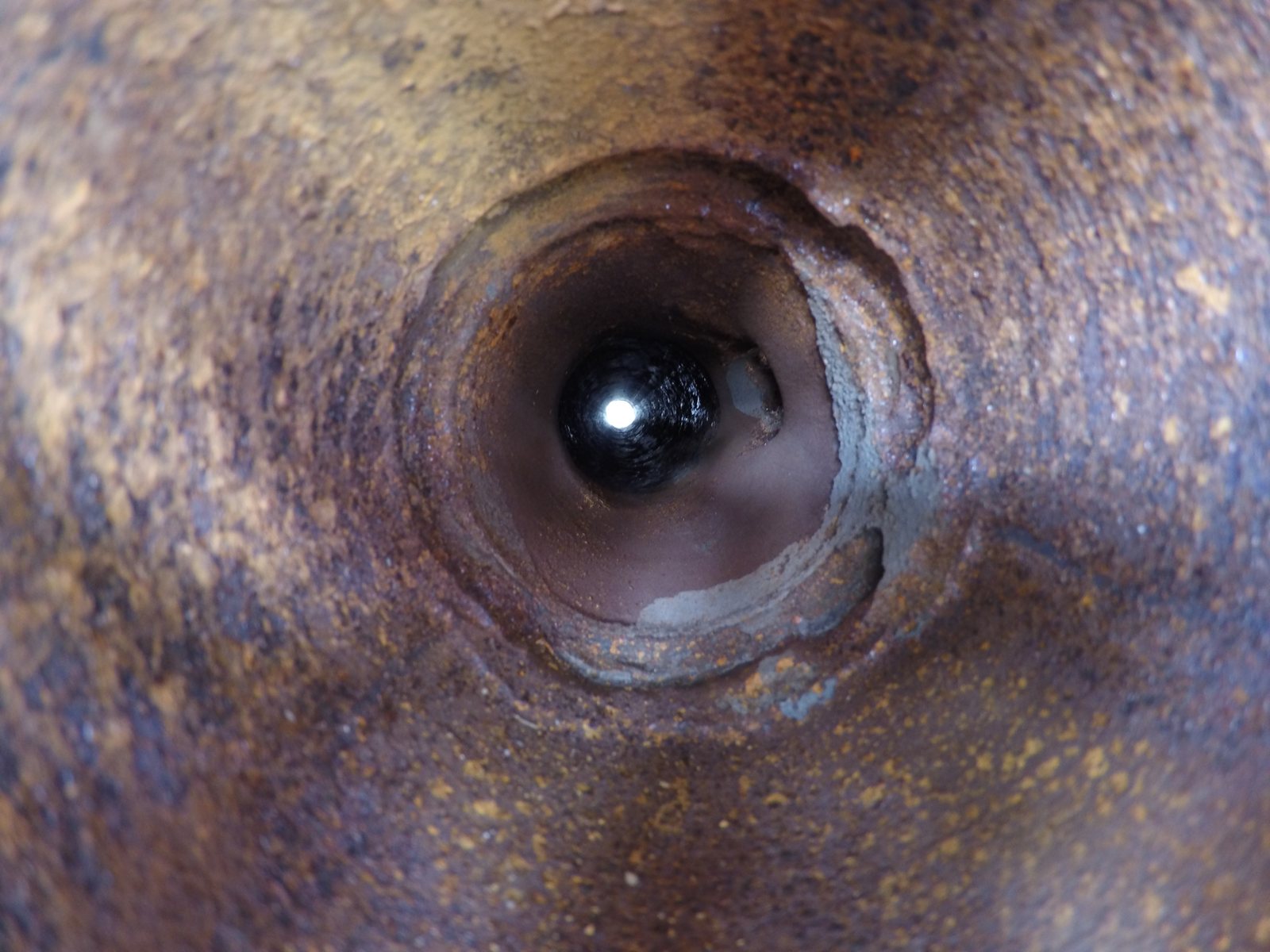 Internal bore of a pipe showing corrosion attack around a branch connection